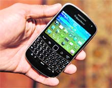 An official of RIM displays a newly launched BlackBerry bold 9900 at a function in New Delhi on Thursday