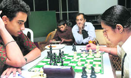Simranjeet Kaur of Saupins School, Sector 32, and Alexender Pearson from the US are all concentration during a chess game in Chandigarh 