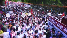 BJP activists gather during a protest against the Congress-led UPA government in New Delhi