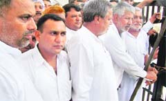 Samain villagers lock a power substation building in Fatehabad