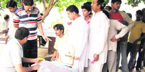 A medical specialist examines jail inmates at the District Jail in Sonepat. 
