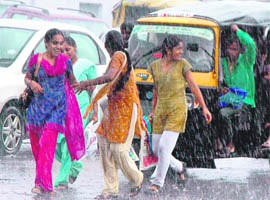 Girls making the most of monsoon showers in Faridabad. 
