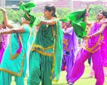 Artistes prepare for a cultural programme to be held during the Independence Day function in Gurgaon