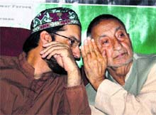 Chairman of the moderate faction of the Hurriyat Conference Mirwaiz Umar Farooq with Abdul Gani Bhat at a seminar in Srinagar on Thursday