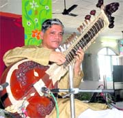 Surbahar maestro Pandit Pushpraj Koshti performs at Police DAV Public School in Jalandhar on Wednesday.