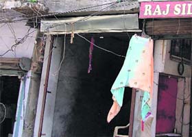 A view of the shop partly demolished by the municipal corporation staff in Ludhiana on Thursday