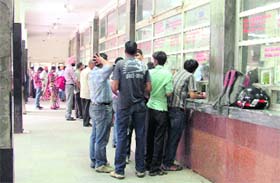 With a counter (extreme right) non-functional, people wait for their turn at other counters of the Ludhiana railway station