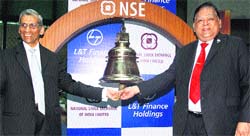 A M Naik (R), CMDof Larsen and Toubro and Y M Deosthalee, Director & CFO of L&T, at the listing ceremony of L&T Finance Holdings at the National Stock Exchange in Mumbai