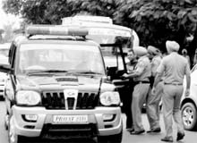 SHO Rajesh Chibber's gunmen grab an accident victim, a junior engineer, by his collar and force him into a police vehicle in Patiala on Friday