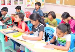 Underprivileged children attend a language class at the Bharat Sevak Samaj in Sector 24, Chandigarh, on Friday