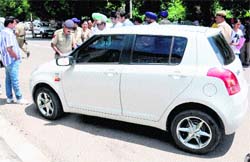 Police officials check documents of a student of DAV College, Sector 10, Chandigarh, on Friday