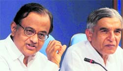 Home Minister P Chidambaram and Minister of Parliamentary Affairs and Water Resourses Pawan Bansal address a press conference in New Delhi.
