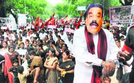 Raising the pitch: An MDMK party activist wears a mask of Sri Lankan President Mahinda Rajapaksa during a protest in New Delhi 