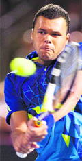 Jo-Wilfried Tsonga in action against Roger Federer at the Rogers Cup in Montreal 