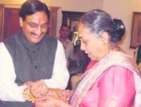 Governor Margaret Alva ties a rakhi to Chief Minister Ramesh Pokhriyal Nishank at Raj Bhavan in Dehradun 