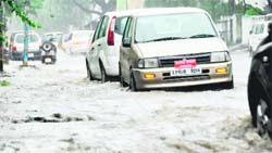 A flooded road in Dehradun after heavy rain 