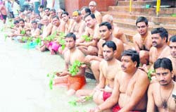 Teerth purohits on the Ganga ghat in Haridwar on the occasion of Rakshabandhan