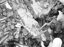 Officials of the district administration pull out a body in Ludhiana on Saturday. 