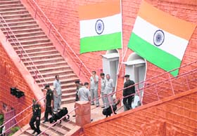 Army soldiers check around the Red Fort before a full dress rehearsal for Independence Day celebrations in New Delhi on Saturday