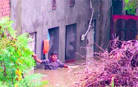 A boy makes a desperate call for help at Mehndipur village in Nawanshahr district on Saturday.
