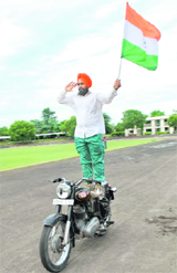On the eve of Independence Day, Dalip Singh, a PRTC worker, performs a stunt at Yadvindra Stadium in Patiala on Sunday.