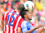 Stokes Marc Wilson (L) vies with Chelsea's Salomon Kalou. 