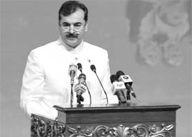 Pakistan PM Yusuf Raza Gilani delivers a speech at the flag-hoisting ceremony during the Independence Day celebrations in Islamabad on Sunday