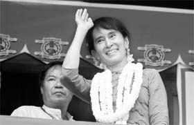 Aung San Suu Kyi waves during the opening ceremony of Aungsan Jar-mon Library at Thanatpin township near Bago on Sunday
