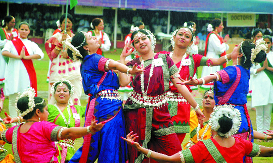 Students present an item during the Independence Day celebrations at the Parade Ground in Dehradun.