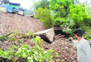 Two houses buried under a landslide in Mandi 