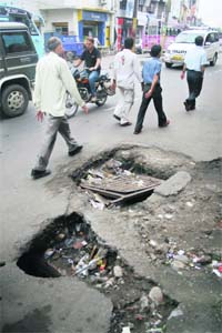 A damaged manhole on the Canal Road near Commerce College in Jammu fails to get the attention of the authorities