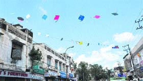 Kites seen stuck on electricity wires in Jammu. Flying kites is a rage among city residents these days
