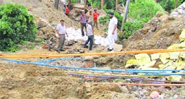 Repair and reconstruction of a caved-in road in progress at the Shaheed Bhagat Singh Nagar locality in Ludhiana on Tuesday.