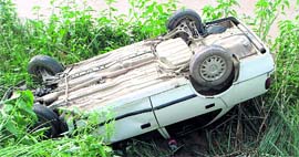 A file photo of a car that overturned after hitting an eroded patch on the road along the Sirhind canal.