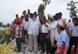 Sekhon along with other officials inspecting the Dhussi bundh along the river Sutlej at Ferozepur.