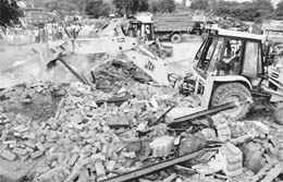 JCB machines being used to demolish illegal structures near the Majri chowk in Panchkula on Wednesday