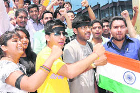 Students of GGDSD College, Sector 32, wear black bands on their arms on Wednesday. 