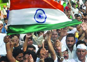 Protestors march from the India Gate to Jantar Mantar in New Delhi on Wednesday