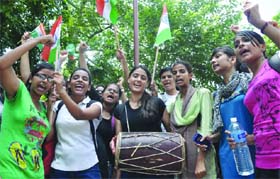 A bunch of students protests in support of Anna Hazare at Chhatrasal Stadium in New Delhi on Wednesday