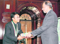 Agni Mitra receives an award from Dr T Chatterjee, Secretary, Union Environment Ministry, at the convocation in the FRI auditorium, Dehradun, on Wednesday.