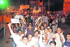 Residents take part in a candlelight procession in favour of Anna Hazares crusade in Rohtak on Tuesday night