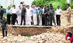 Chief Minister Omar Abdullah inspects a damaged bridge on the outskirts of Jammu on Wednesday