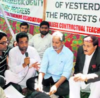 Protesting contractual college teachers call off their fast in the presence of Minister for Higher Education Abdul Gani Malik (second from right) in Srinagar on Wednesday