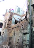 A view of an unsafe building being demolished in the Maliganj area in Ludhiana