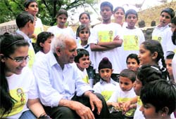 Rock Garden creator Nek Chand interacts with children from the SOS village, Rajpura