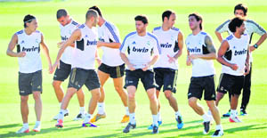 Real Madrid players take part in a training session in Madrid on the eve of their Super Cup second leg match against Barcelona. 