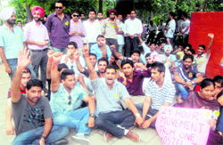 SOPU members protest outside a girls hostel in support of their demands at Panjab University, Chandigarh, on Thursday