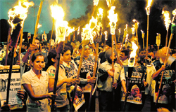 Supporters of Anna Hazare take out a 'mashal' march on Madhya Marg in Chandigarh on Thursday