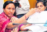 Radha Raturi, state Chief Electoral Officer, addresses a press conference in Dehradun