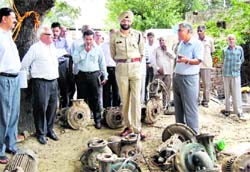 Simardeep Singh, SP, and Arun Malik, SE, Bhakhra Water Services Circle, Kaithal, show the equipment seized from farmers who were found stealing canal water in Kaithal